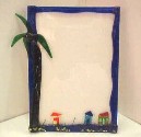 Glass frame with palm tree and houses